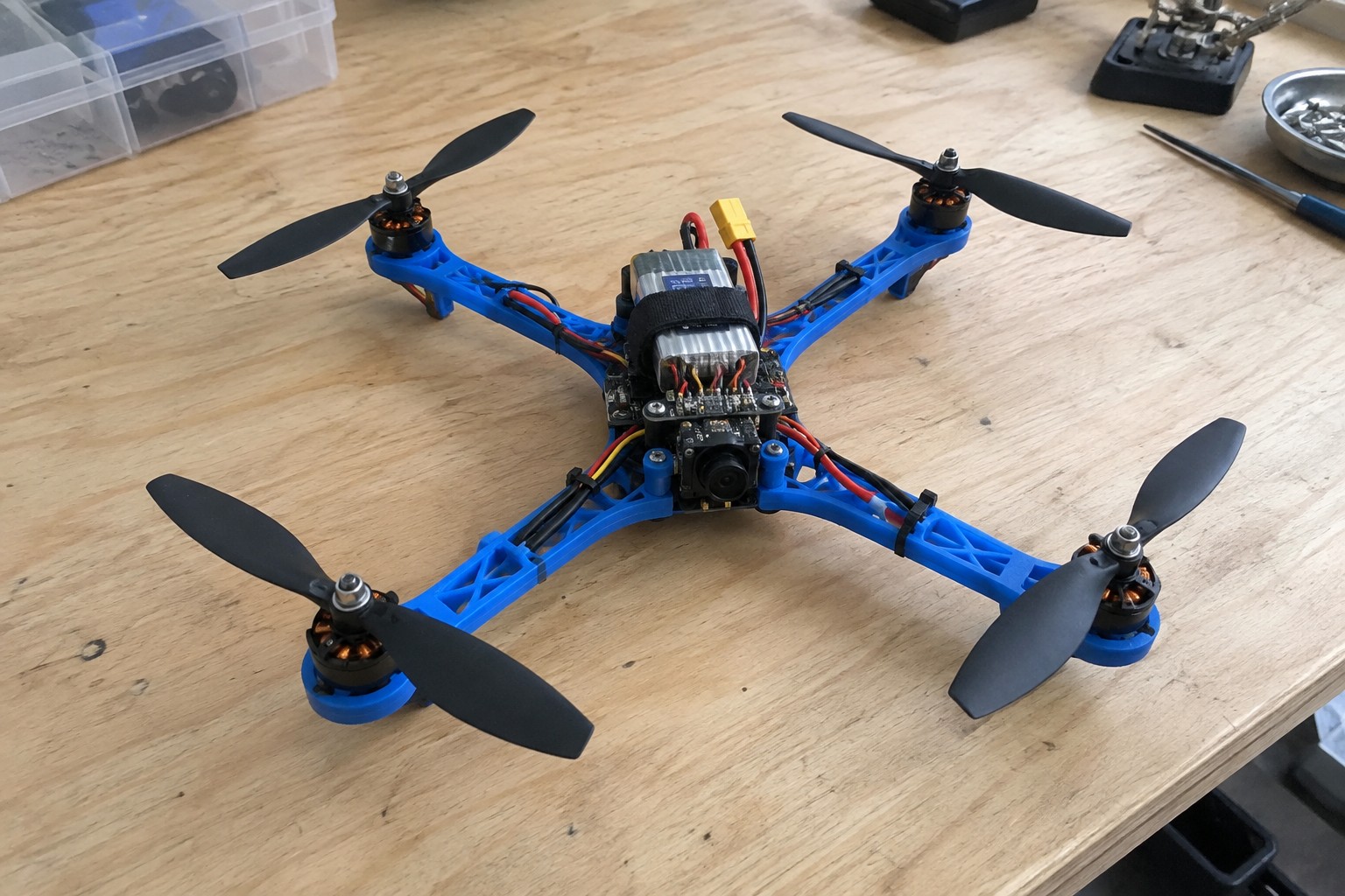 Concept illustration of a student-built quadcopter on a workbench