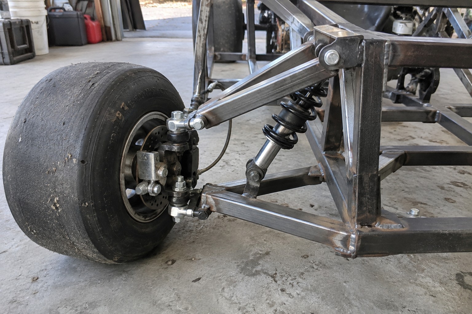 Concept illustration of a student-scale go-kart suspension and brake assembly